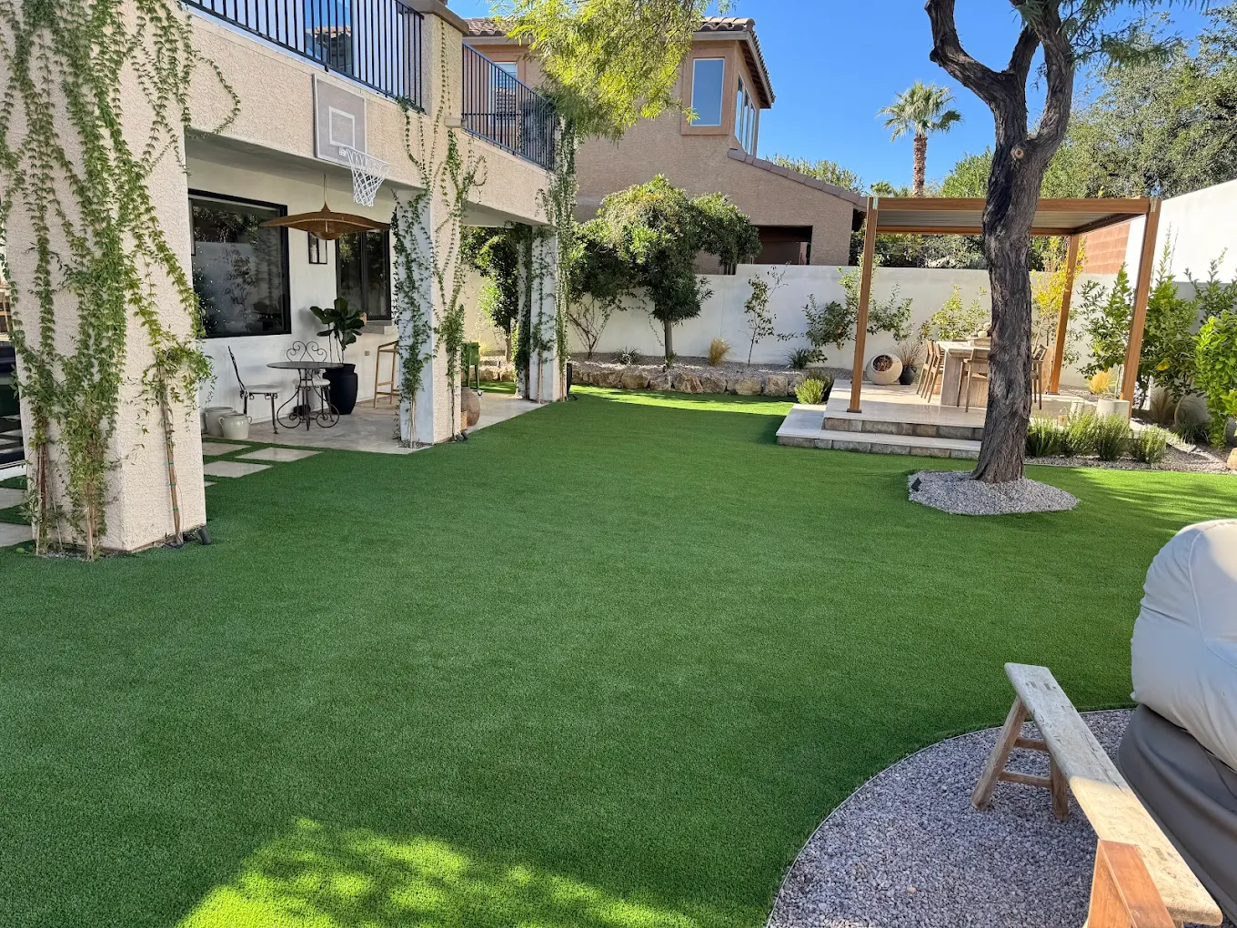 Modern patio with well-maintained artificial turf in a San Diego backyard